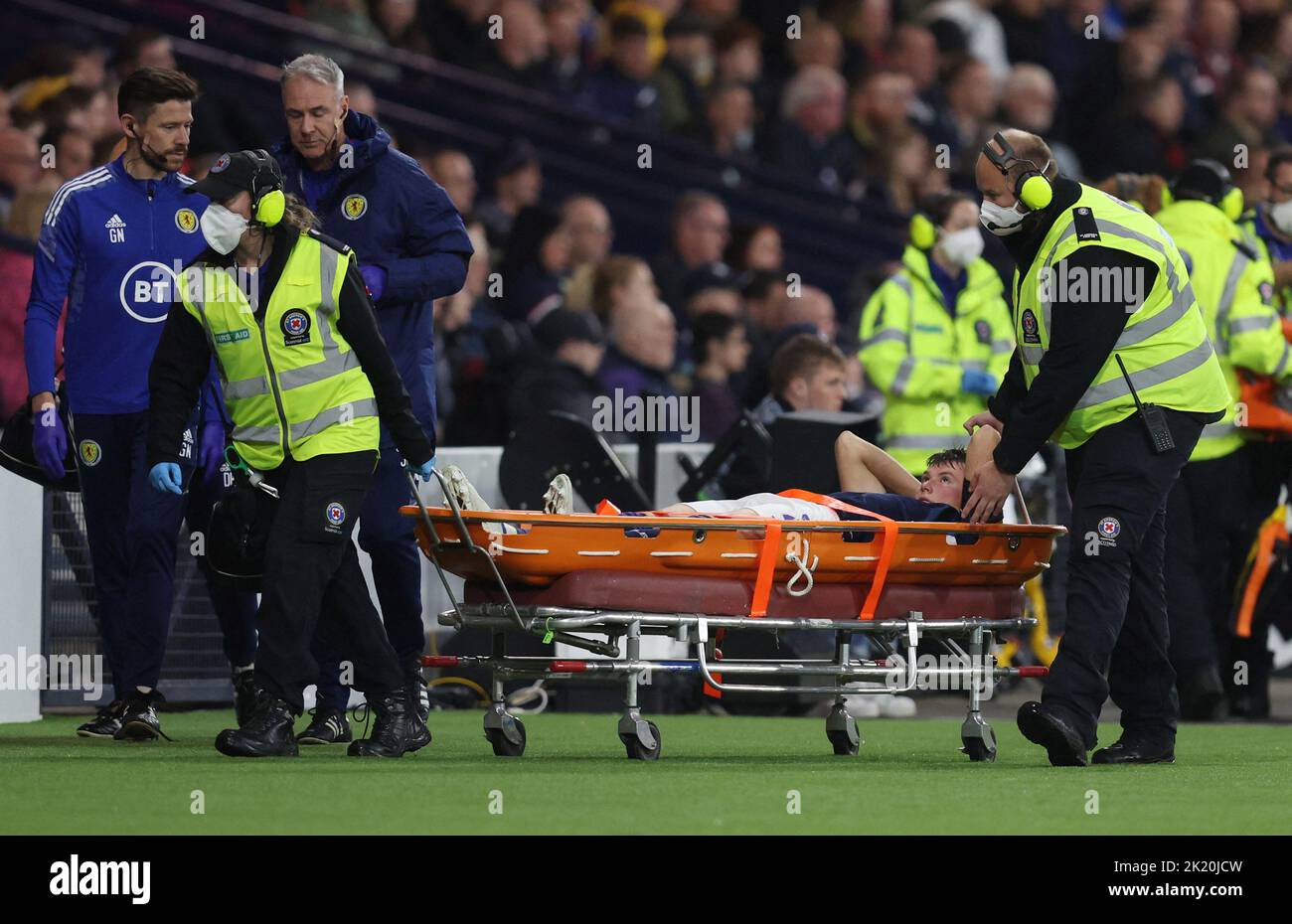 Soccer Football - UEFA Nations League - Group E - Scotland v Ukraine - Hampden Park, Glasgow, Scotland, Britain - September 21, 2022 Scotland's Nathan Patterson is stretchered off after sustaining an injury REUTERS/Russell Cheyne Stock Photo