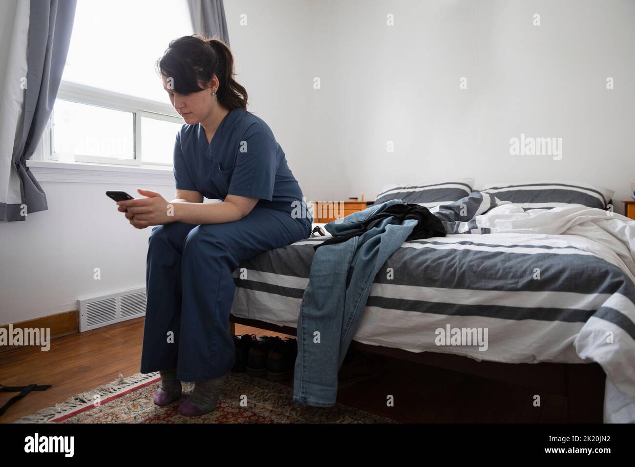Portrait young nurse in scrubs hi-res stock photography and images - Alamy
