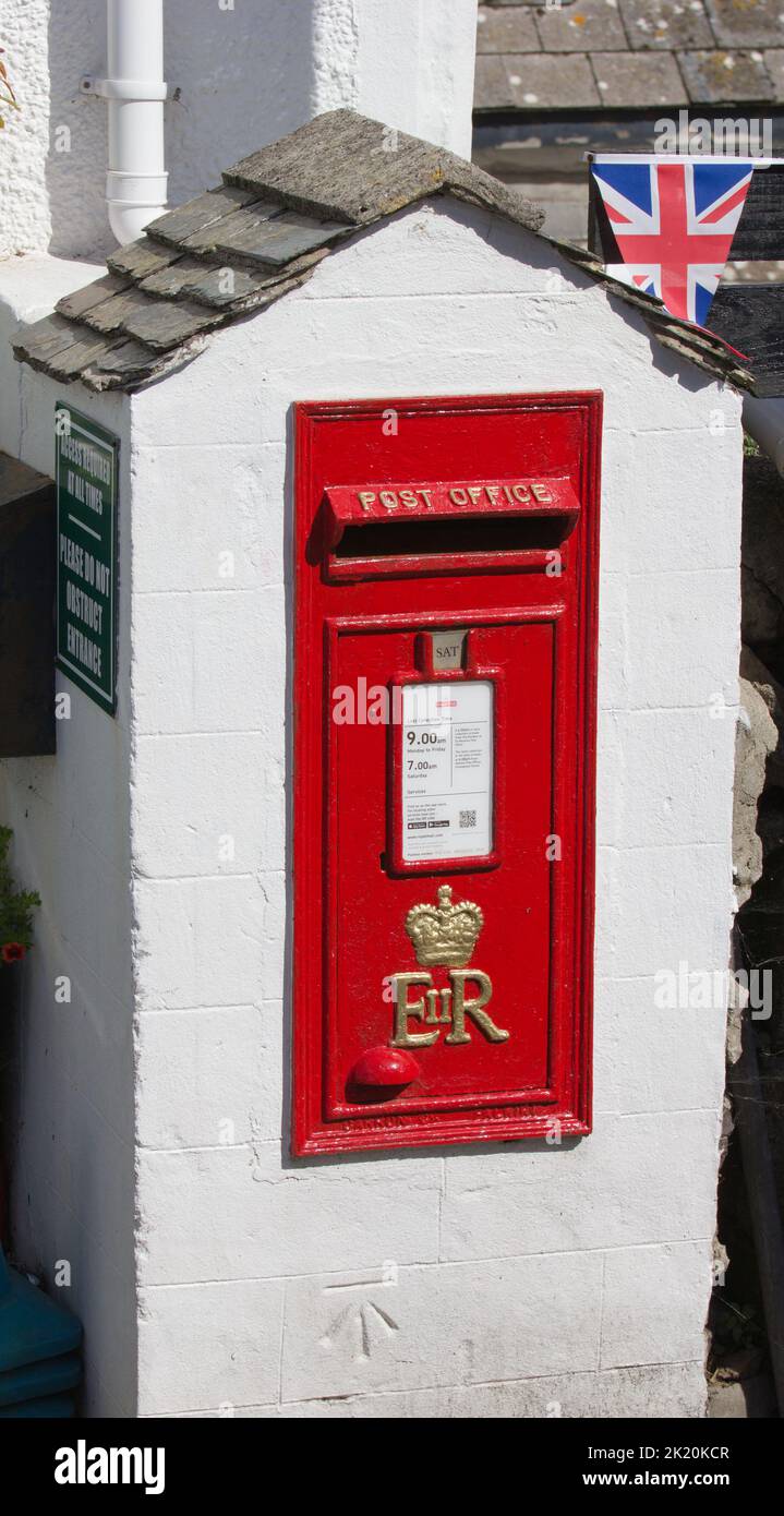 Post Office post box, Coverack, Cornwall.  ER symbol. And Union Flag. Made at the Carron works, Falkirk, Scotland. Stock Photo
