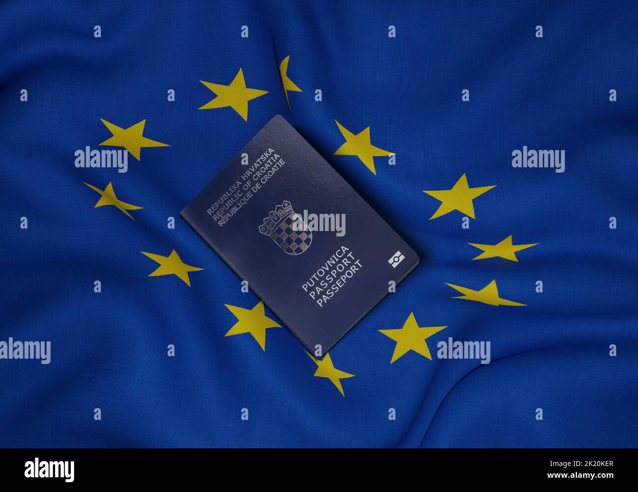 Croatia passport with European Union flag in background Croatian passport is issued to citizens of the Republic of Croatia for the purpose of internat Stock Photo