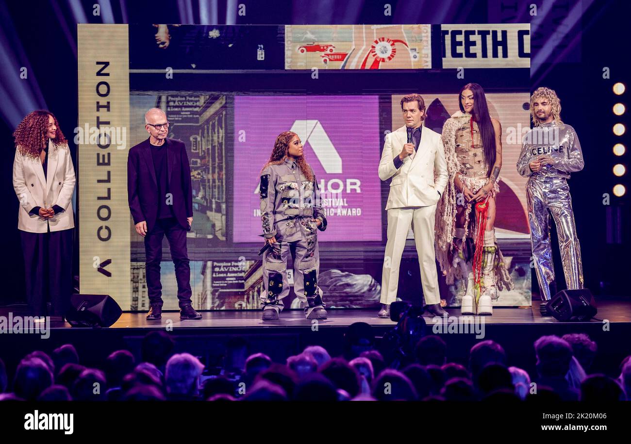 Hamburg, Germany. 21st Sep, 2022. The jury consisting of singer Joy Denalane (l-r), music producer Tony Visconti, singer, activist and actress Tayla Parx, Pelle Almqvist, frontman of the band The Hives, drag queen Pabllo Vittar and singer, designer and book author Bill Kaulitz on stage at the opening of the Reeperbahn Festival. The Reeperbahn Festival is a large club festival around Hamburg's Reeperbahn with concerts, visual arts, film and literature, promotion of young talent and a specialist conference for the music and digital industries. Credit: Axel Heimken/dpa/Alamy Live News Stock Photo