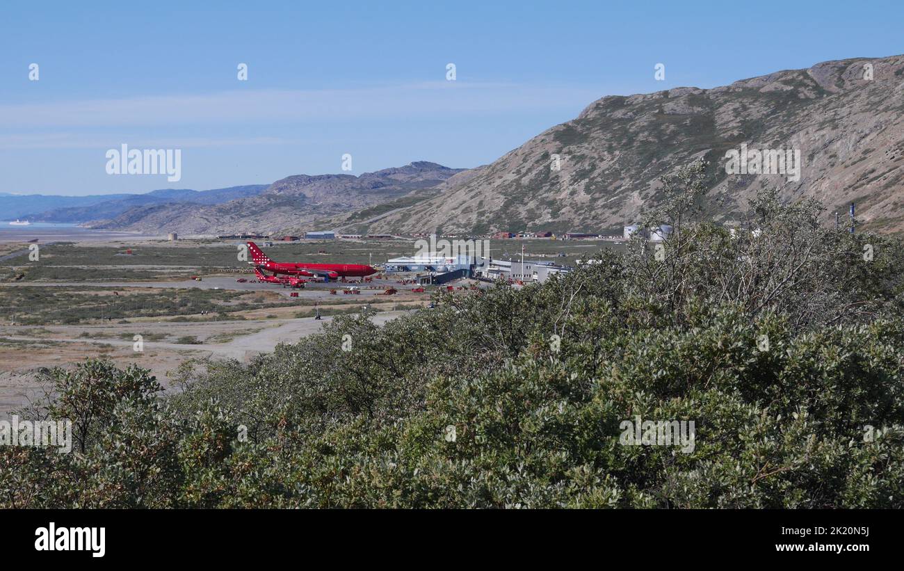 Kangerlussuaq airport in Greenland with cruise ship on horizon Stock Photo