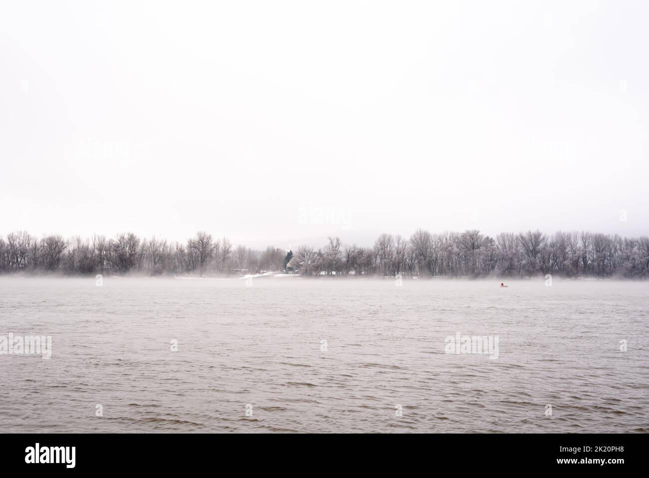Fantastic foggy river in winter Stock Photo - Alamy