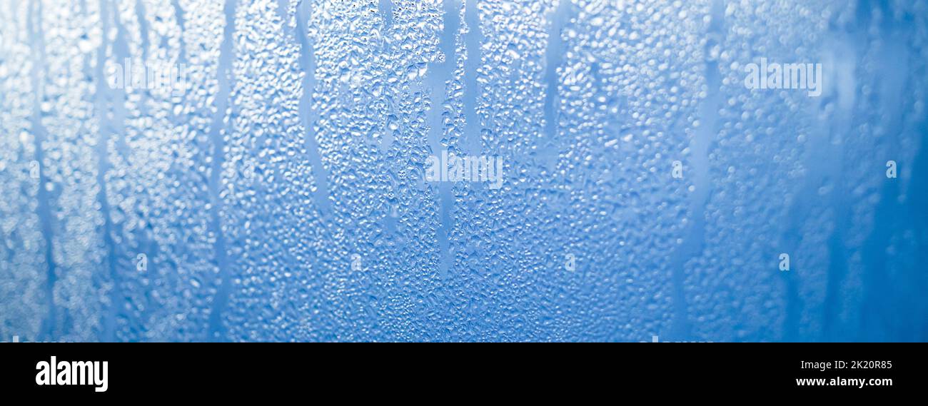 Texture of misted glass in autumn. Drops of water on window in rainy ...
