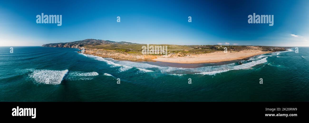 Aerial panorama of Guincho Beach, Cascais, Portugal with Cabo da Roca visible on far right Stock Photo