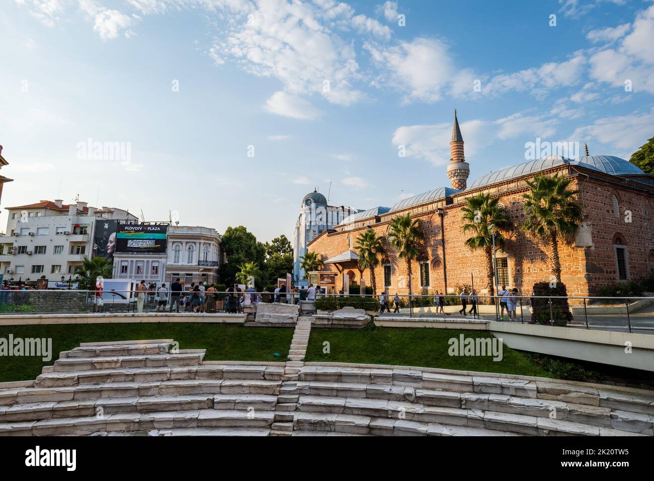 Plovdiv, Bulgaria, July 2022: Plovdiv city center with Dzhumaya mosque and the ancient Stadium of Philipopolis ruins under modern Plovdiv, Bulgaria Stock Photo