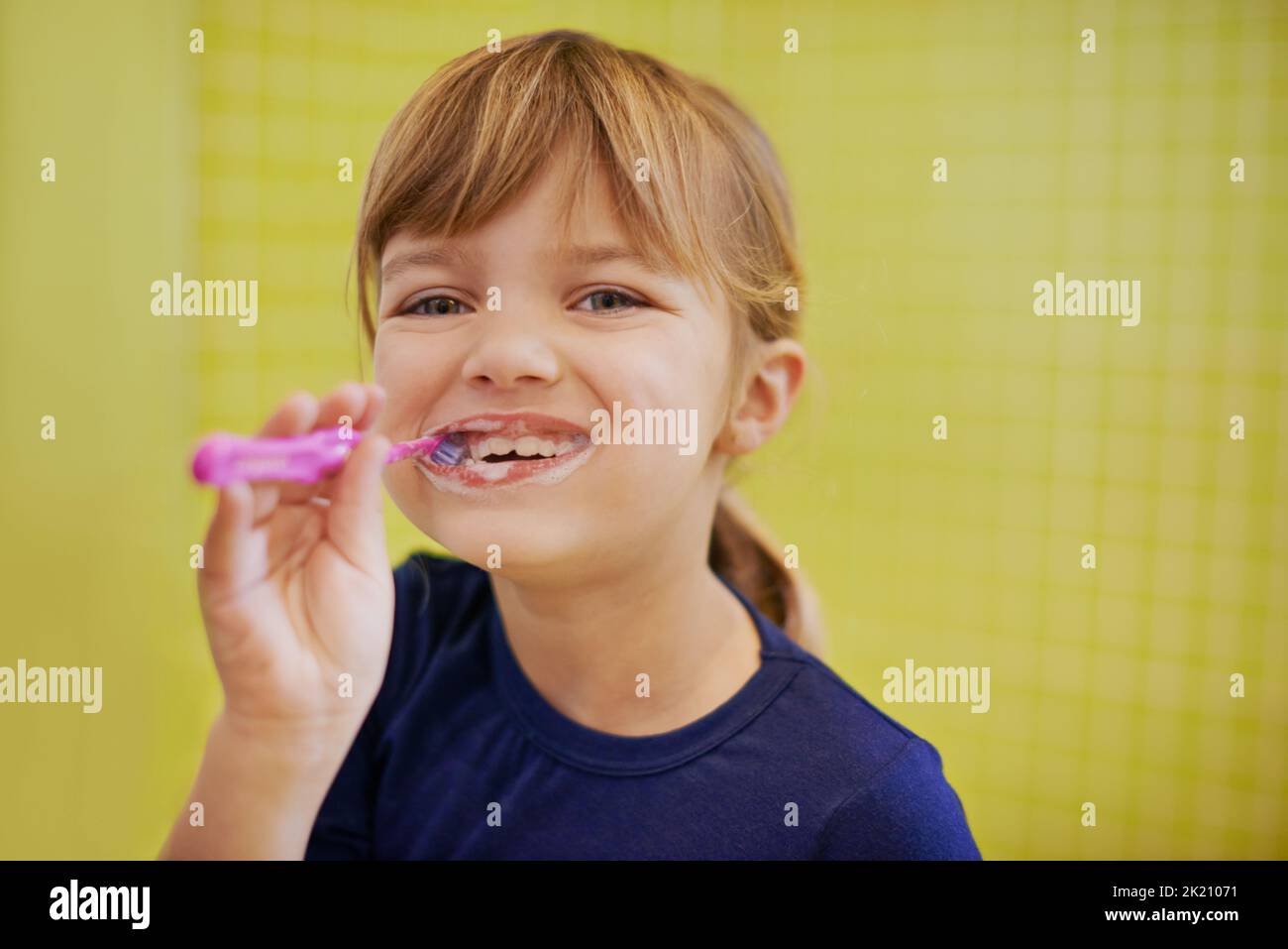 Keeping decay away. Portrait of a cute little girl brushing her teeth. Stock Photo