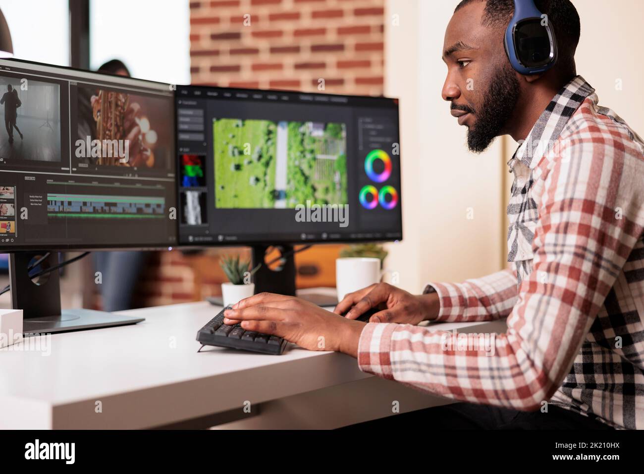 African american filmmaker editing audio film montage on professional