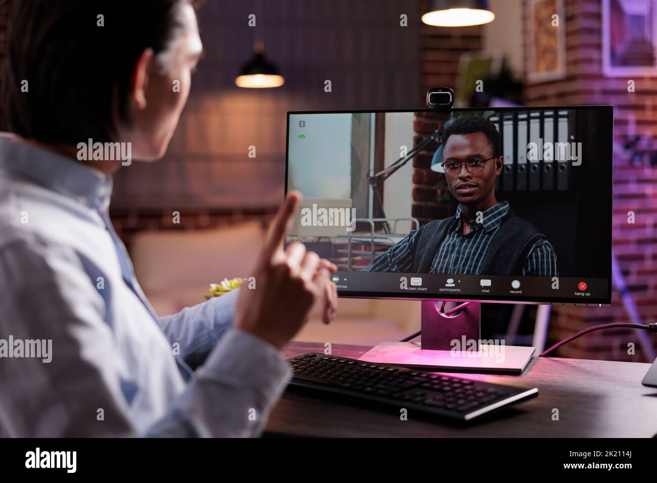 Man attending online meeting hi-res stock photography and images - Alamy