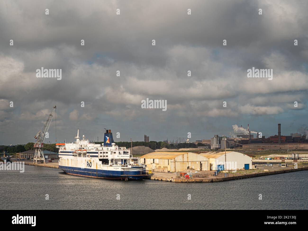 Europe, France, Dunkerque - July 9, 2022: Port scenery. Blue-white P&O  Pride of Burgundy Passenger and RO-RO Cargo ship docked at quay 6 with warehou Stock Photo