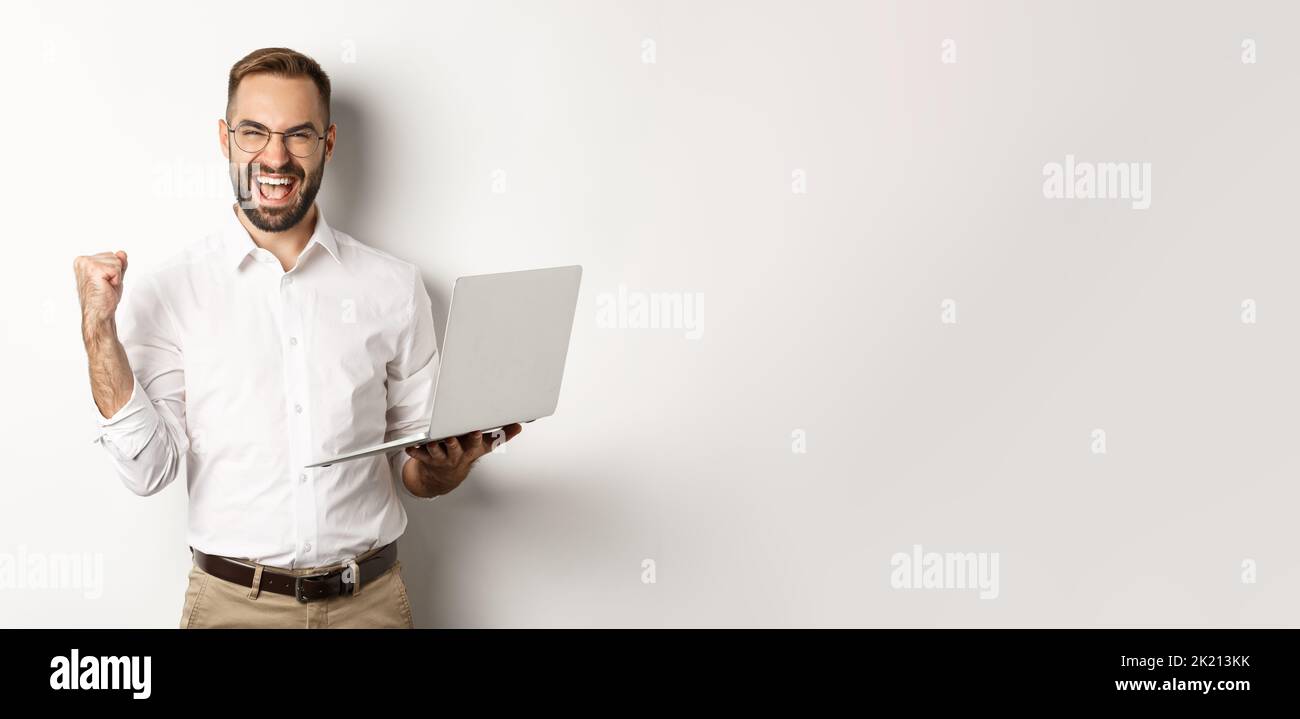 Happy Program Manager Business. Happy manager winning online, rejoicing with fist pump ...