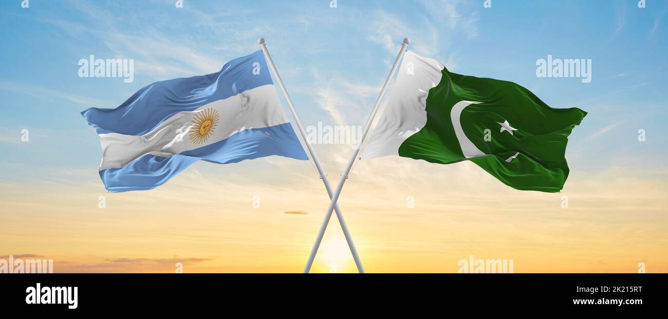 crossed national flags of Argentine and Pakistan flag waving in wind at ...