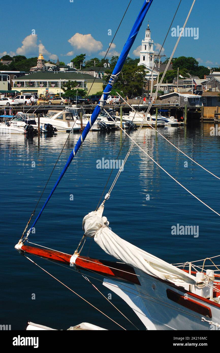 Sailboats and other pleasure ships and boats are at rest in a marina