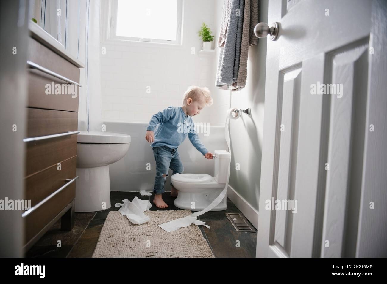 Boy sitting on toilet hires stock photography and images Alamy