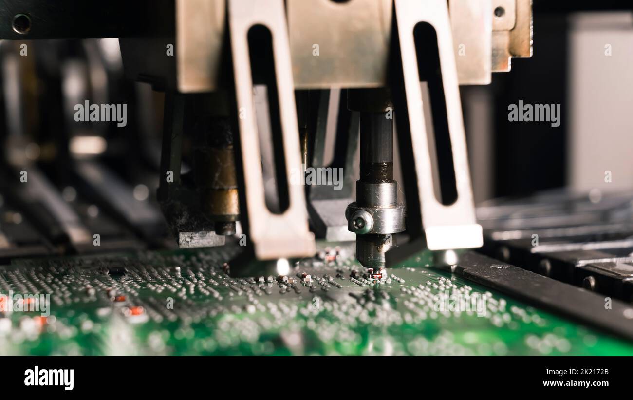 Modern technology concept. Smd montage machine during work. Little ...