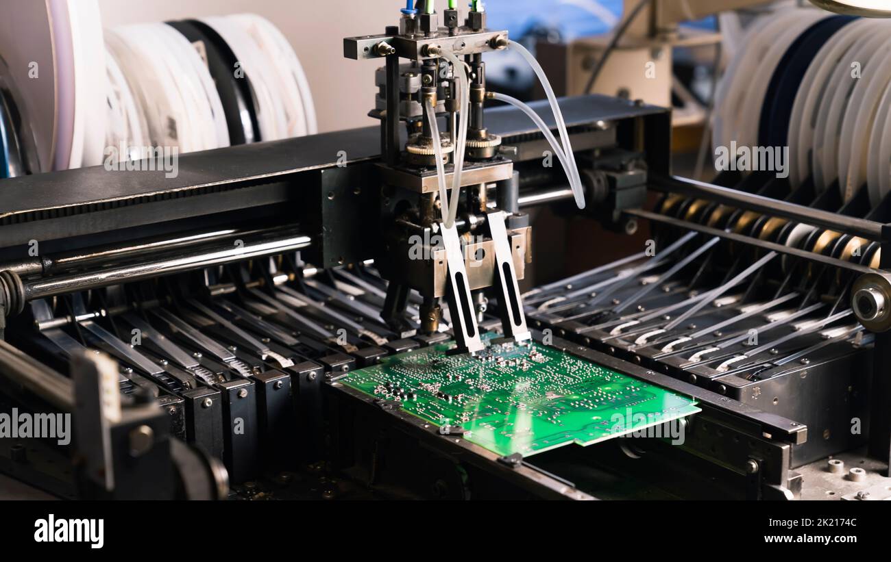 Surface-mount technology machine indoor closeup. Specialistic equipment used to build most modern electronic devices. High quality photo Stock Photo