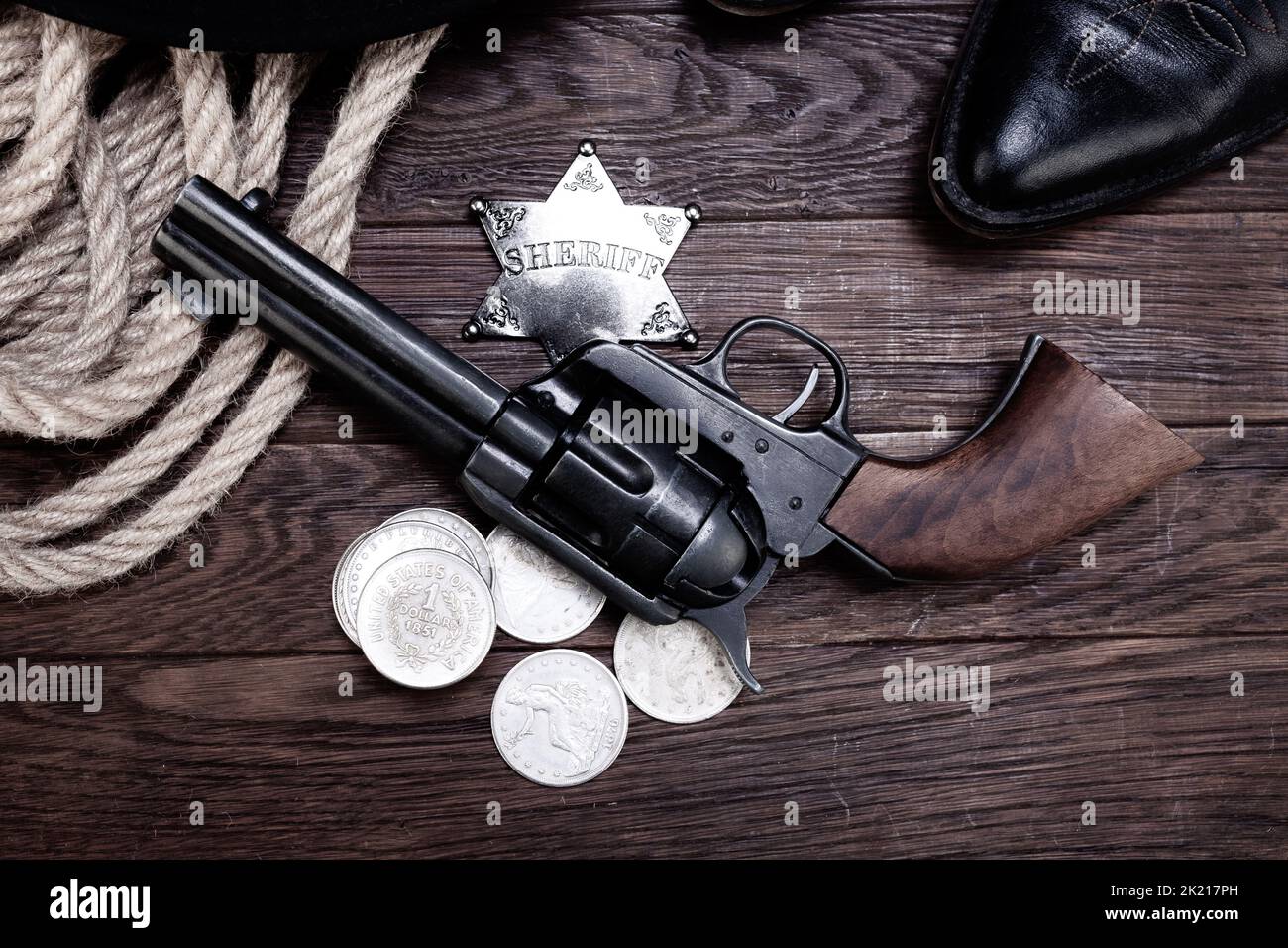 Old west law enforcement revolver guns with sheriff badge and silver
