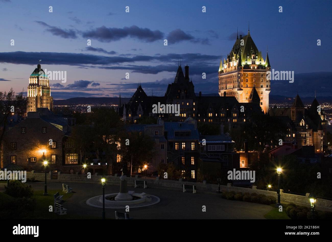 Saint-Denis Avenue and Chateau Frontenac through park at dusk, Quebec City, Quebec, Canada Stock Photo