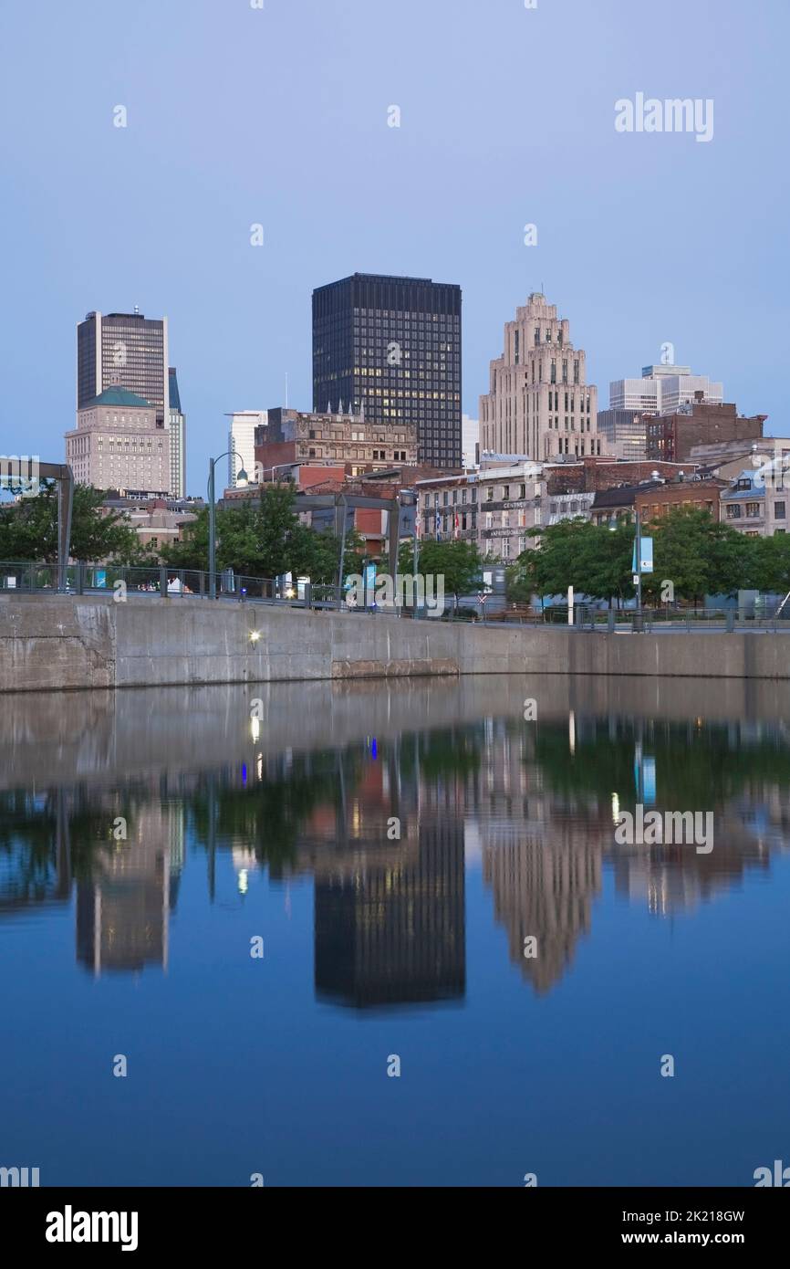 Montreal skyline reflected in Bonsecours Bassin at dawn in spring, Quebec, Canada Stock Photo