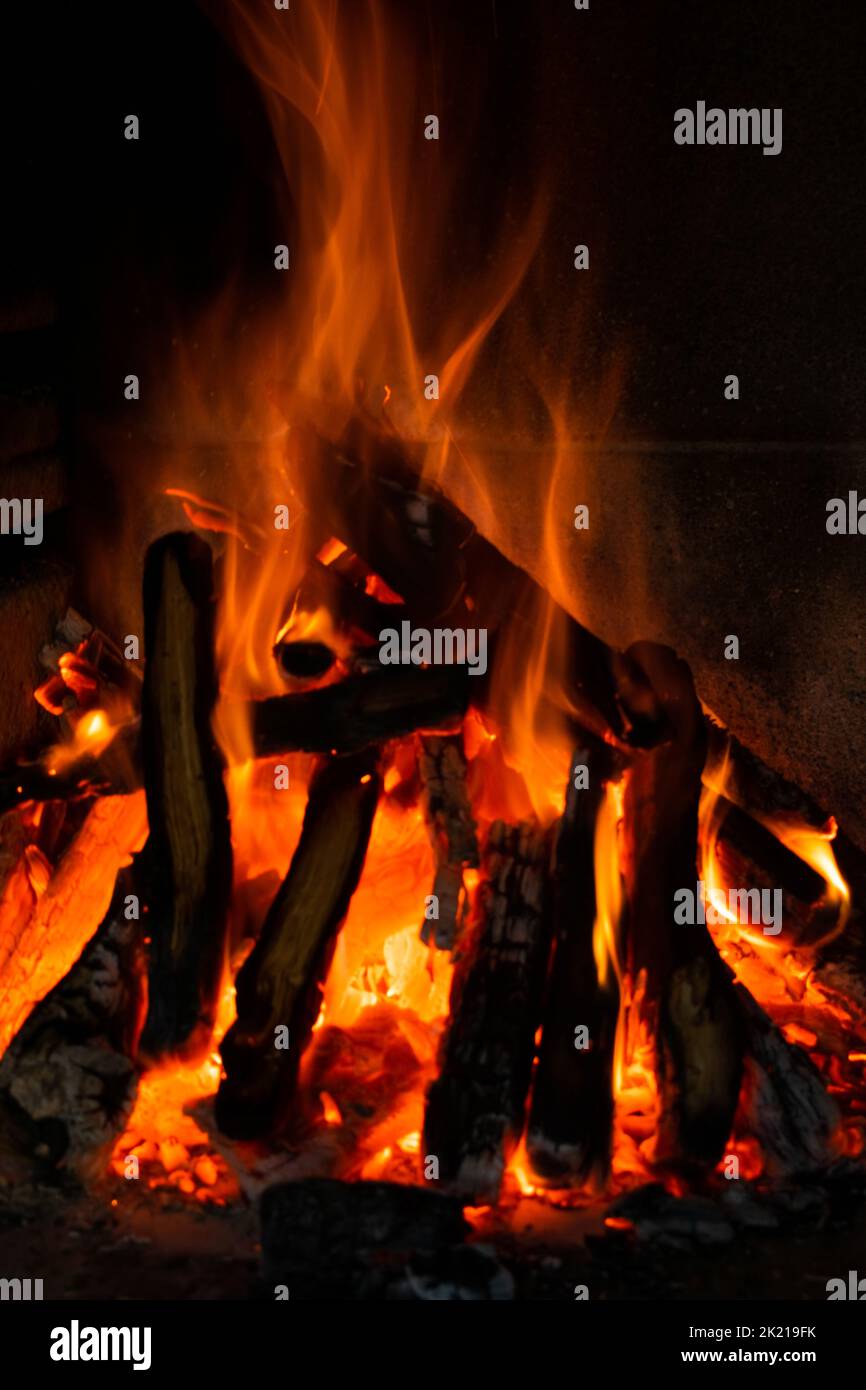 Firewood logs burning in a bonfire Stock Photo