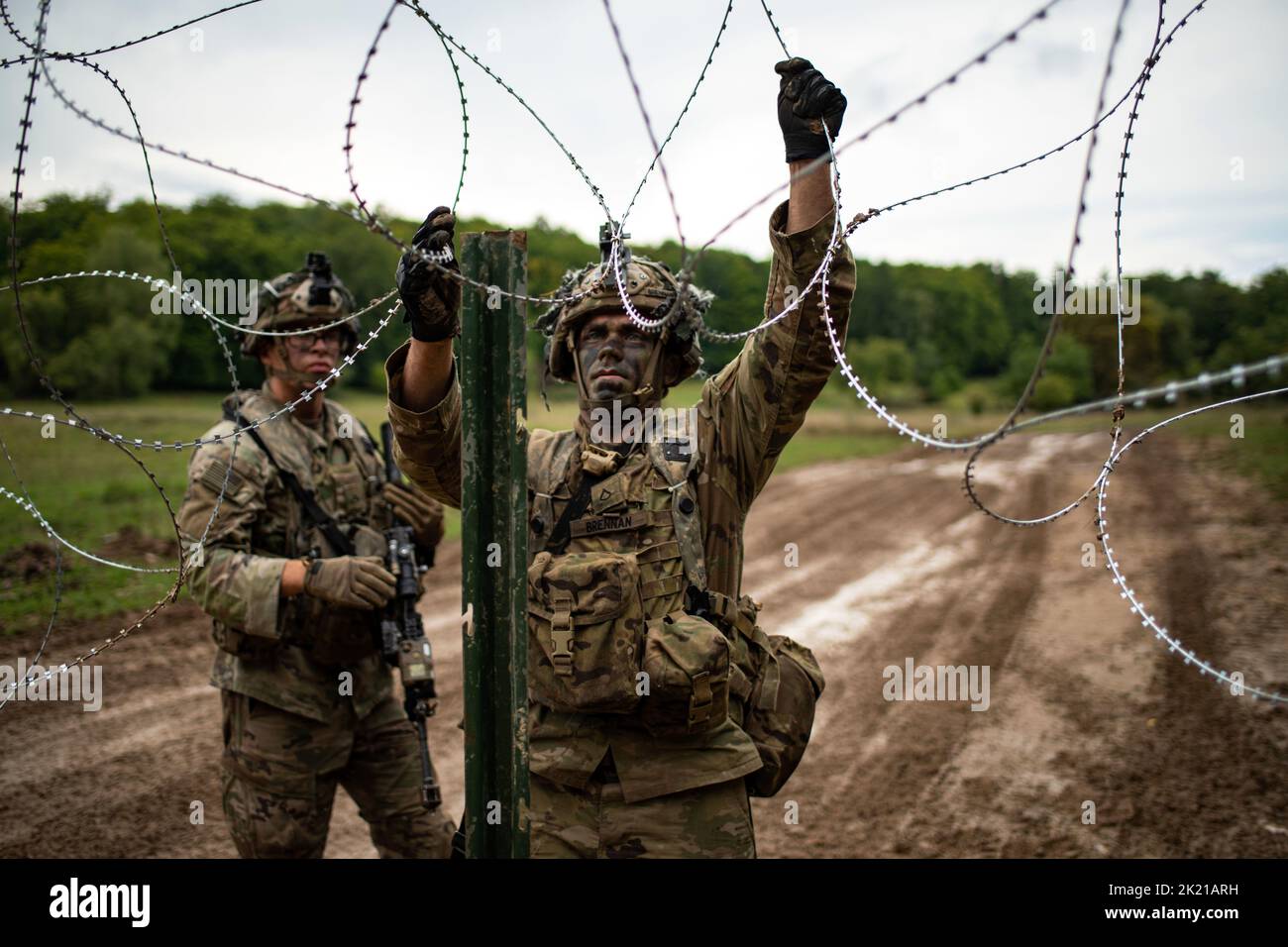 Germany. 14th Sep, 2022. U.S. Army paratroopers assigned to 2nd Battalion, 503rd Parachute Infantry Regiment build obstacles with C-wire along a route at the Joint Multinational Readiness Center in Hohenfels, Germany as part of Exercise Saber Junction 22, Septembert. 14, 2022. Credit: U.S. Army/ZUMA Press Wire Service/ZUMAPRESS.com/Alamy Live News Stock Photo