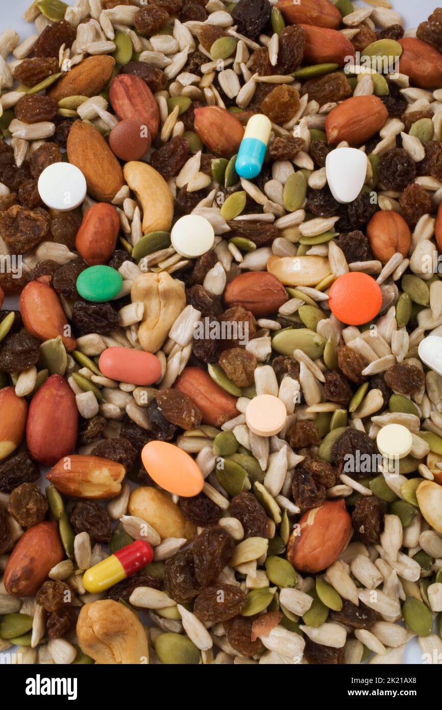 Dried fruit and nuts mixed with medicine pills, Studio Composition, Quebec, Canada Stock Photo