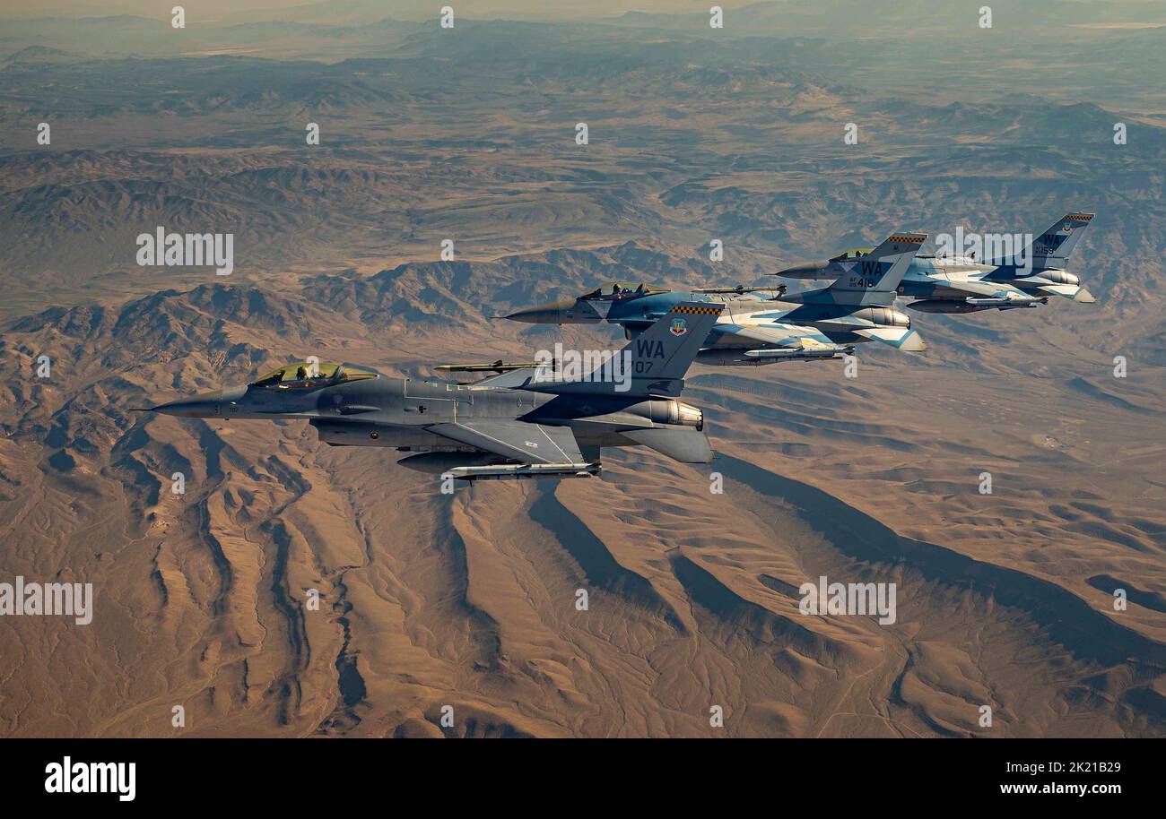 Nellis Air Force Base, United States. 01 September, 2022. Nellis Air Force Base, United States. 01 September, 2022. U.S. Air Force F-16 Fighting Falcon fighter jets with the 64th Aggressor Squadron, fly in formation during a routine training mission at the Nevada Test and Training Range, September 1, 2022, in Nellis Air Force Base, Nevada. The Aggressor program teaches Air Combat Maneuvering also called dog fighting. Stock Photo
