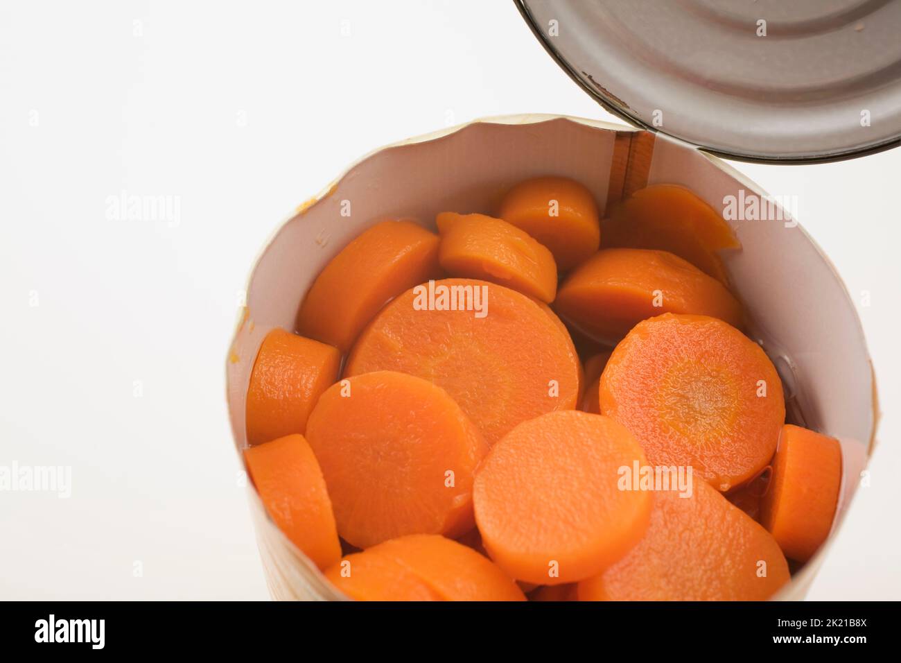 Close-up of sliced carrots in tin can on white background, Studio Composition, Quebec, Canada Stock Photo