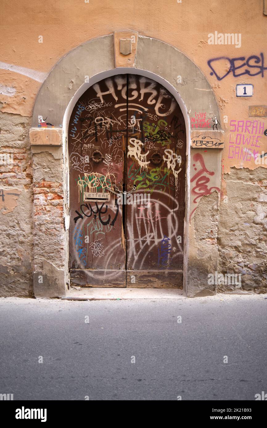 Graffiti Covered Door in the University District Bologna Italy Stock Photo