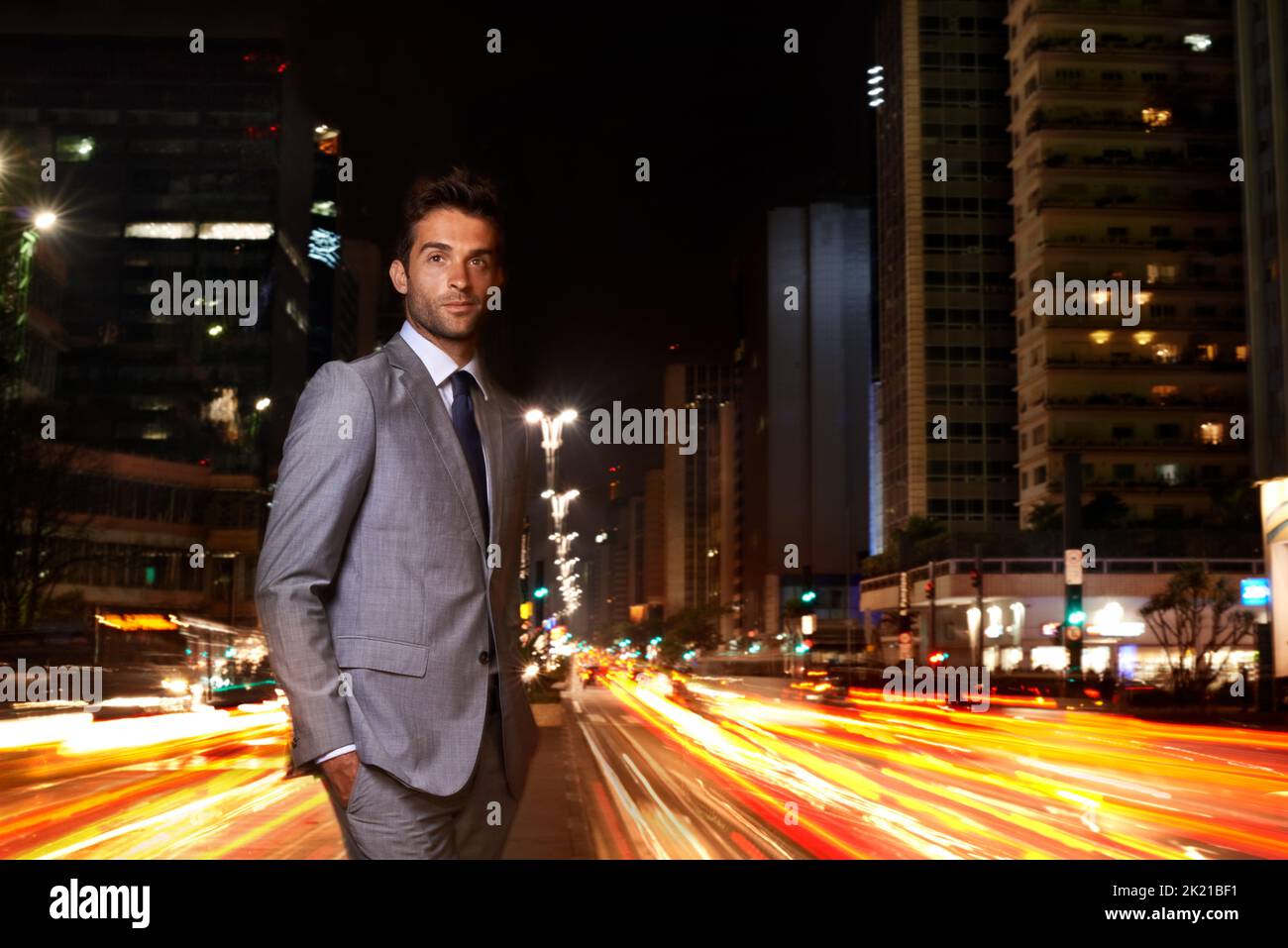The city looks good on him. A handsome businessman standing in the ...