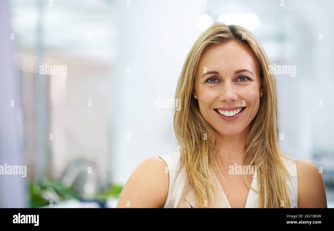 Theres no feeling quite like success. Portrait of an attractive female expressing positivity indoors. Stock Photo