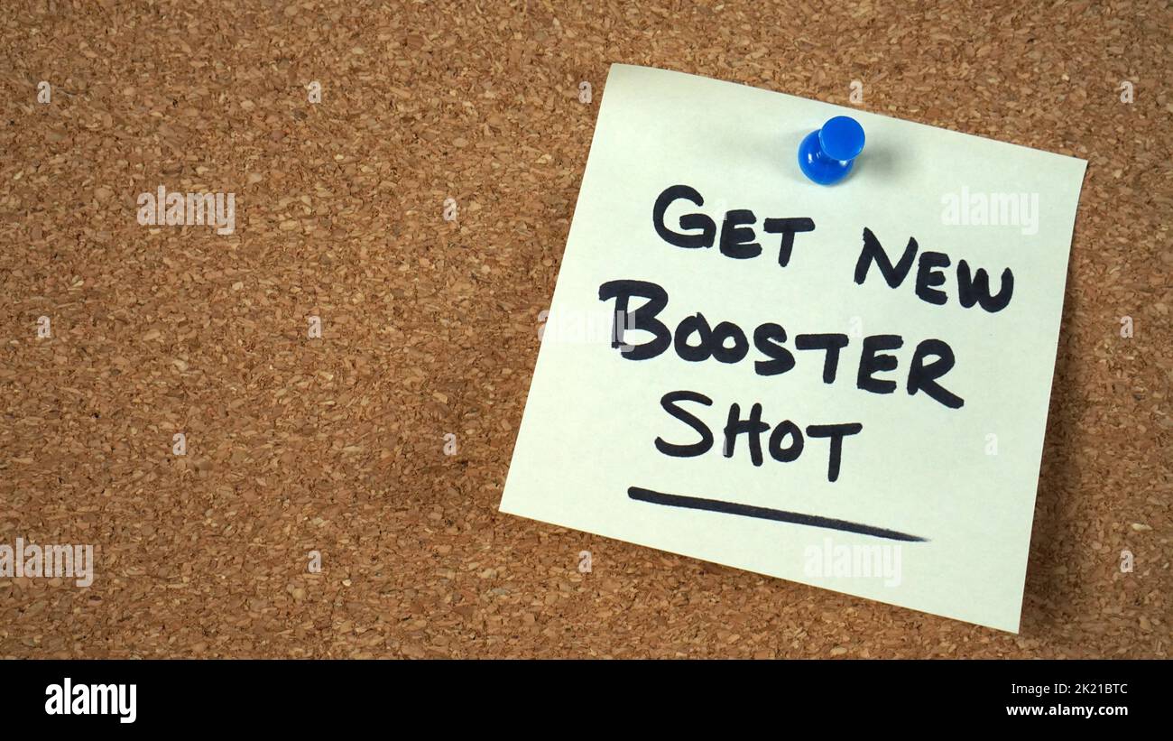 Sticky note reminder to get new bivalent Covid booster shot Stock Photo