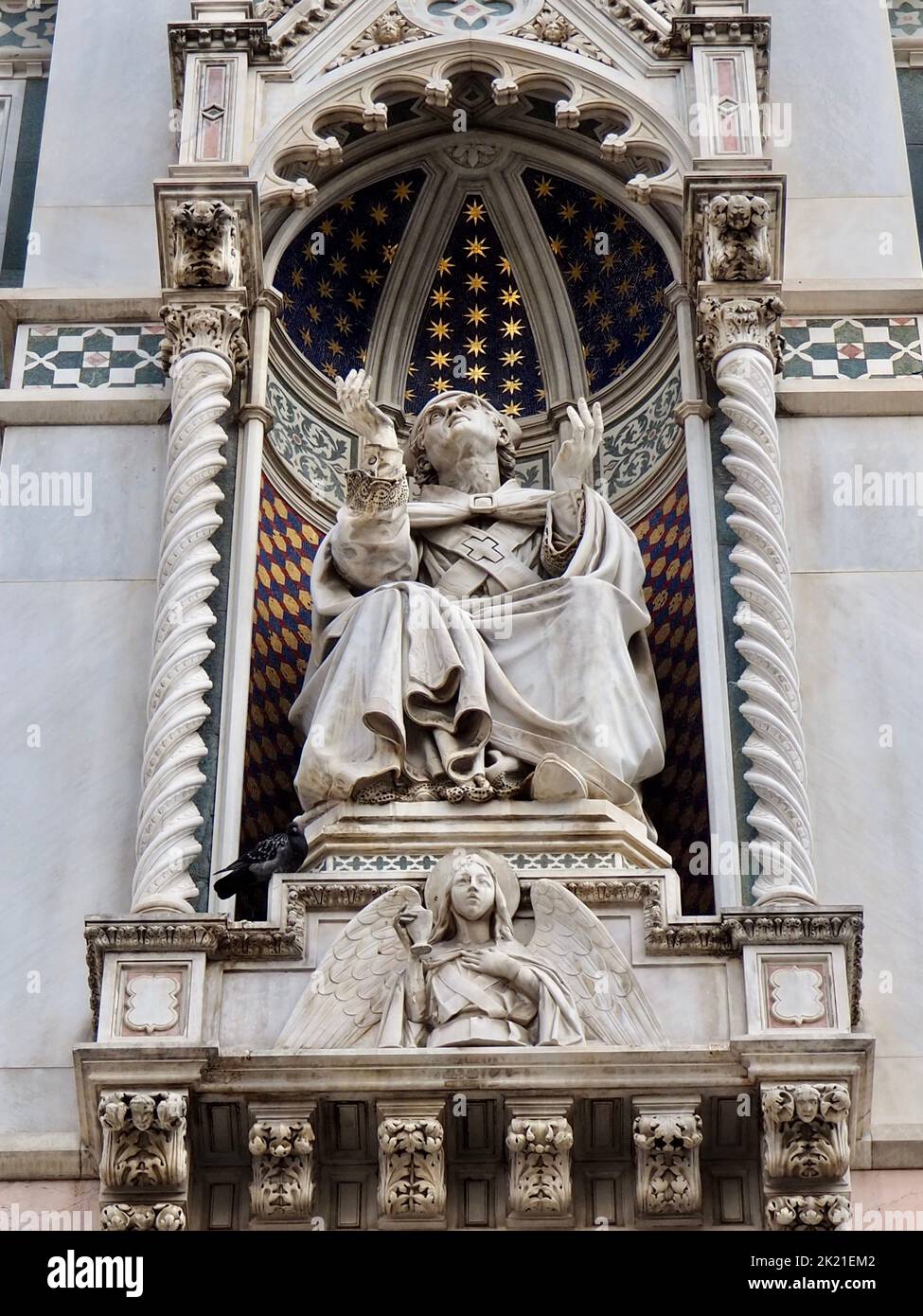 A statue on the frontal facade of the Cathedral of Santa Maria del Fiore Stock Photo