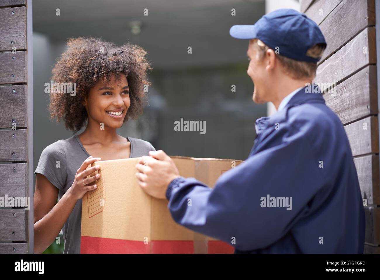 Courier delivery parcel to customer hi-res stock photography and images ...