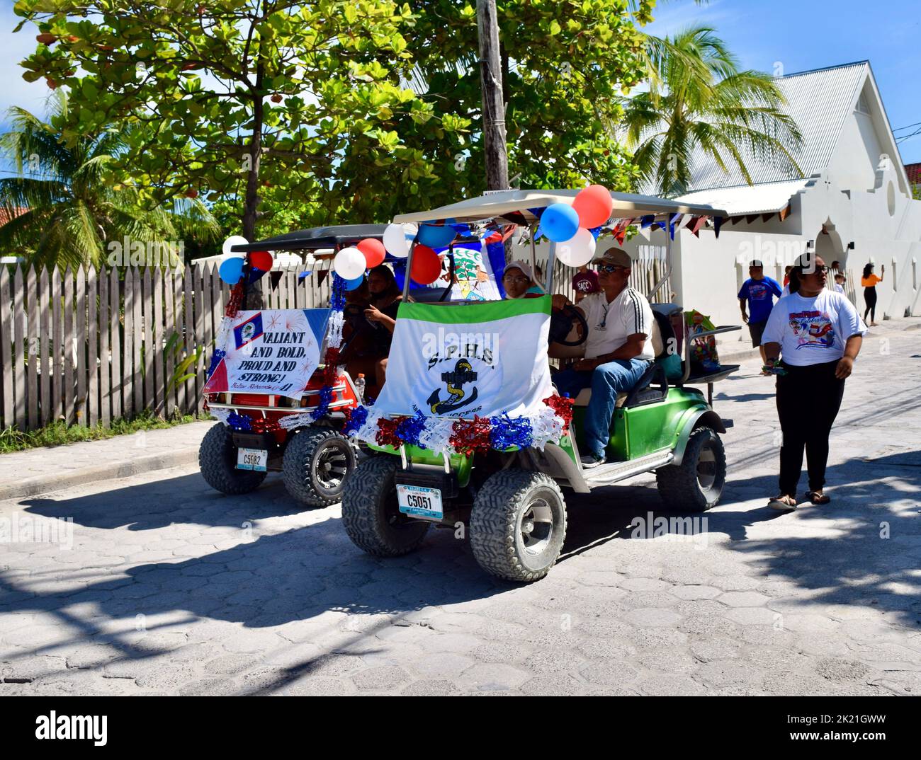 Two decorated golf carts leading the way for the San Pedro High School