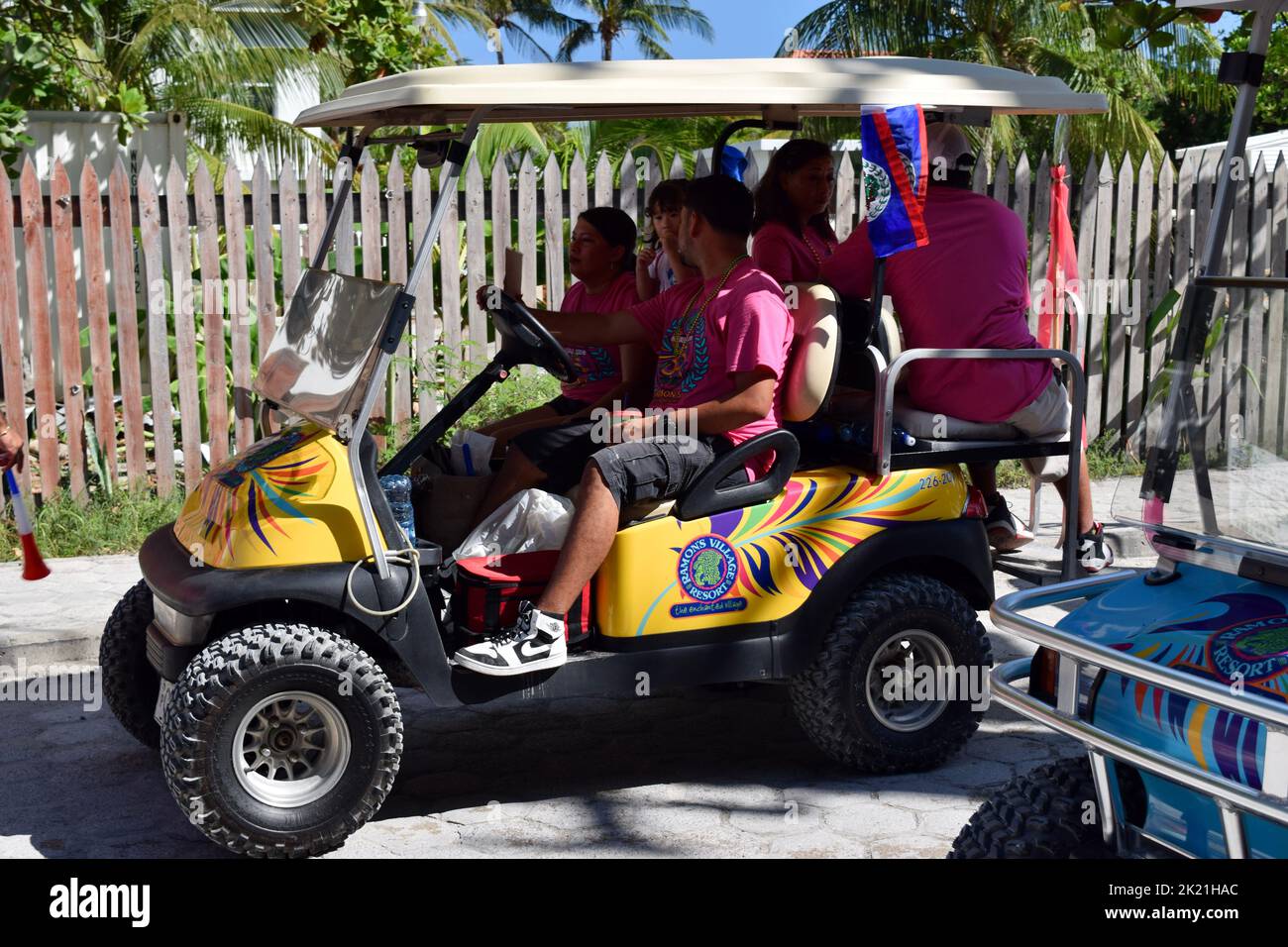 Imaginatively and colorfully decorated golf carts parading in the San Pedro, Belize, Carnival 2022 procession. Stock Photo