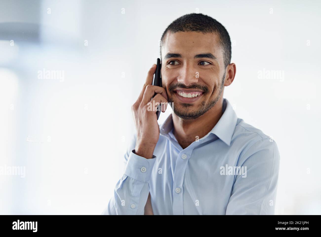 The call hes been waiting for. a handsome young businessman using in ...