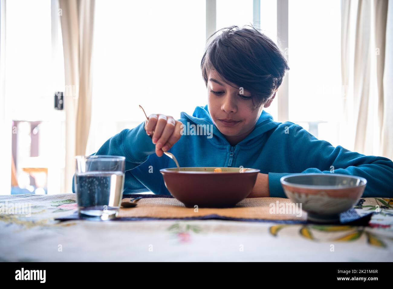 Boy eating lunch hi-res stock photography and images - Alamy