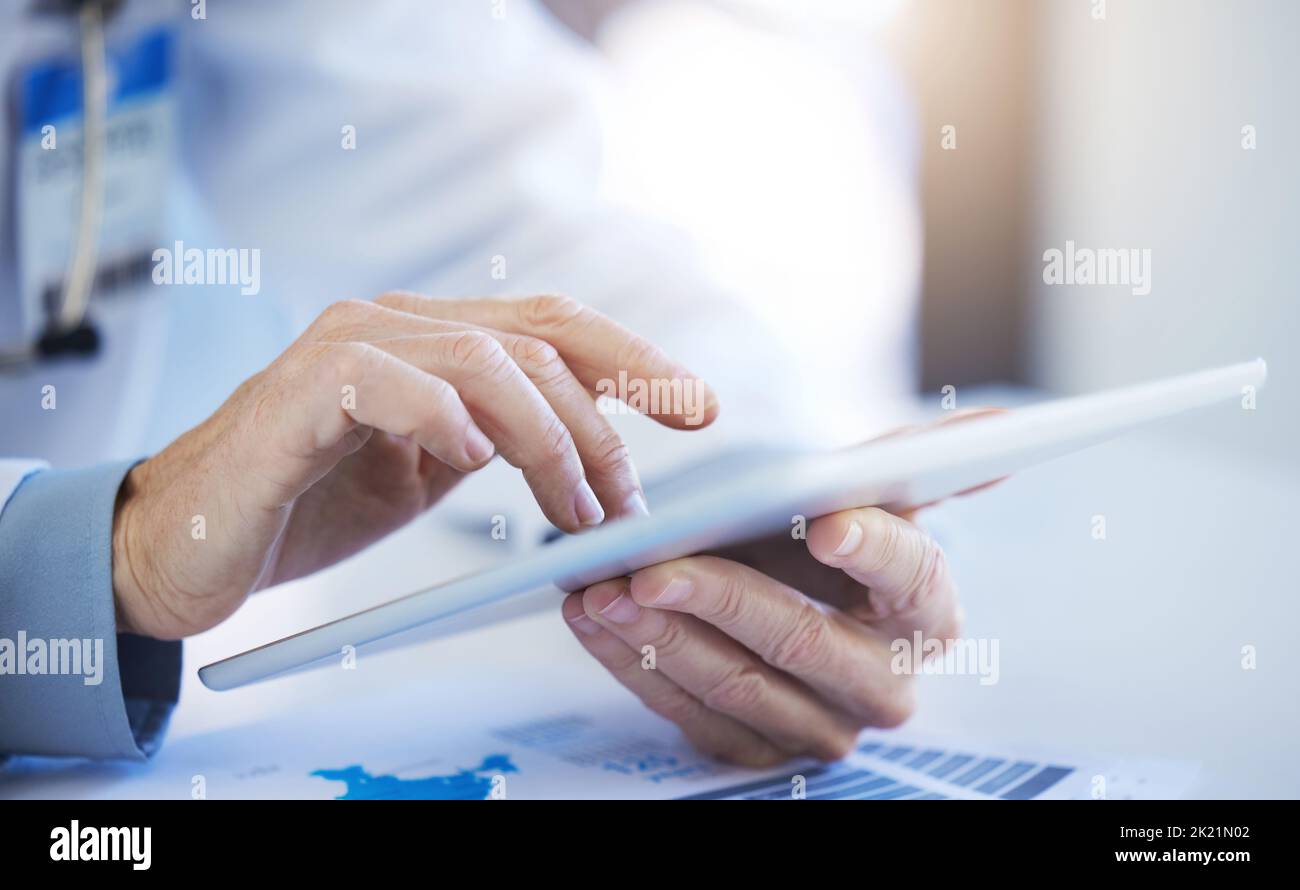 Tablet, business worker and digital research of a employee using technology to work. Hands typing, working and doing IT web analytics for a cloud Stock Photo