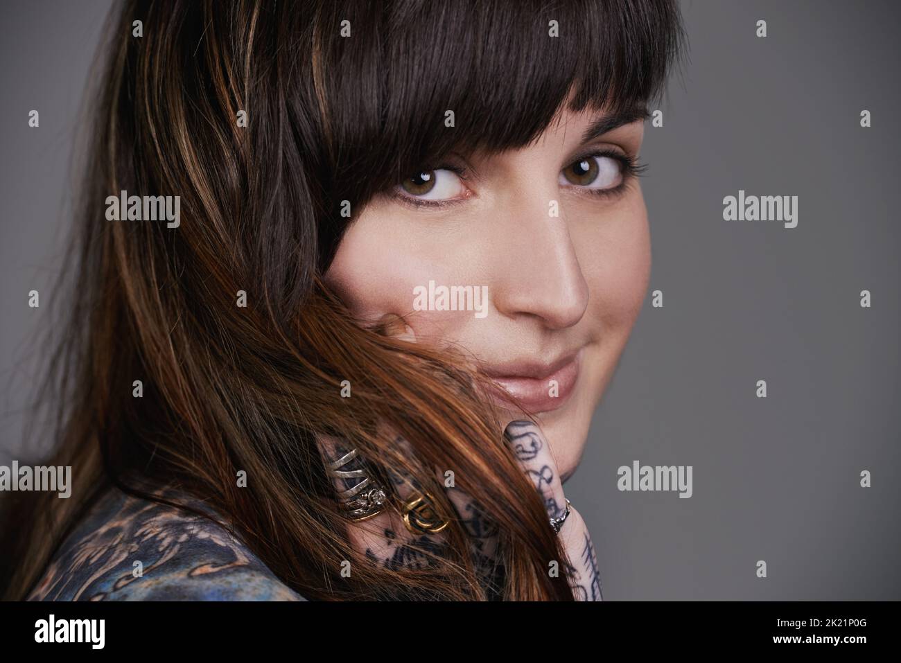 I define my beauty. A cropped studio portrait of a beautiful tattooed young woman. Stock Photo