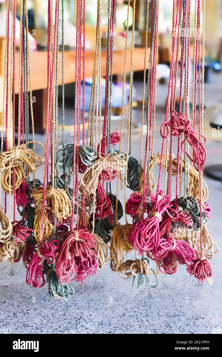 Many colorful prepared threads for weaving hammocks in vietnam Stock Photo