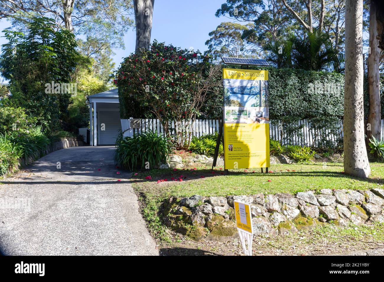 Australian detached house for sale in Avalon Beach,Sydney with real estate agents marketing sign outside,Australia Stock Photo