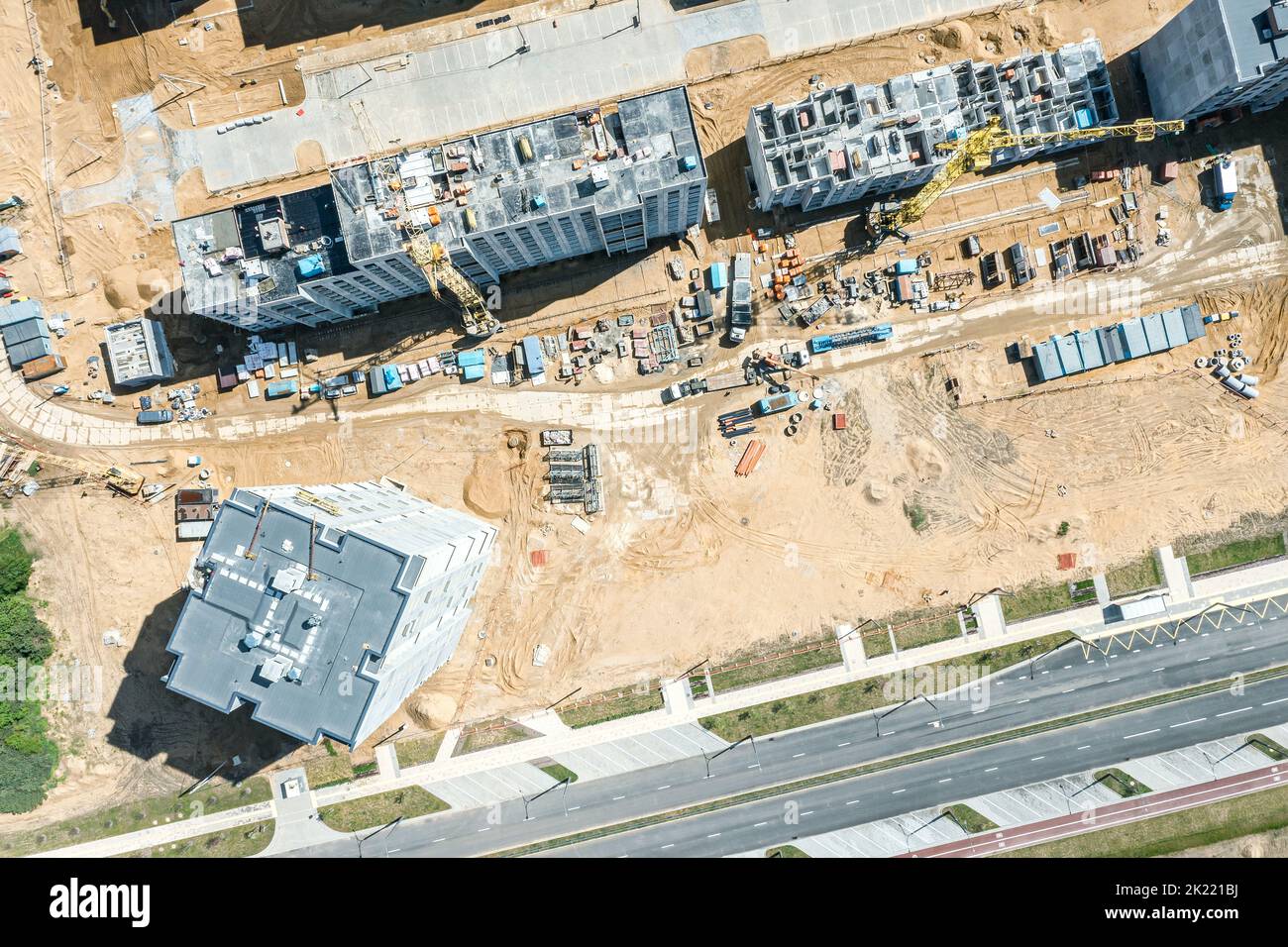 building construction site with working crane and other machinery. aerial overhead view. Stock Photo