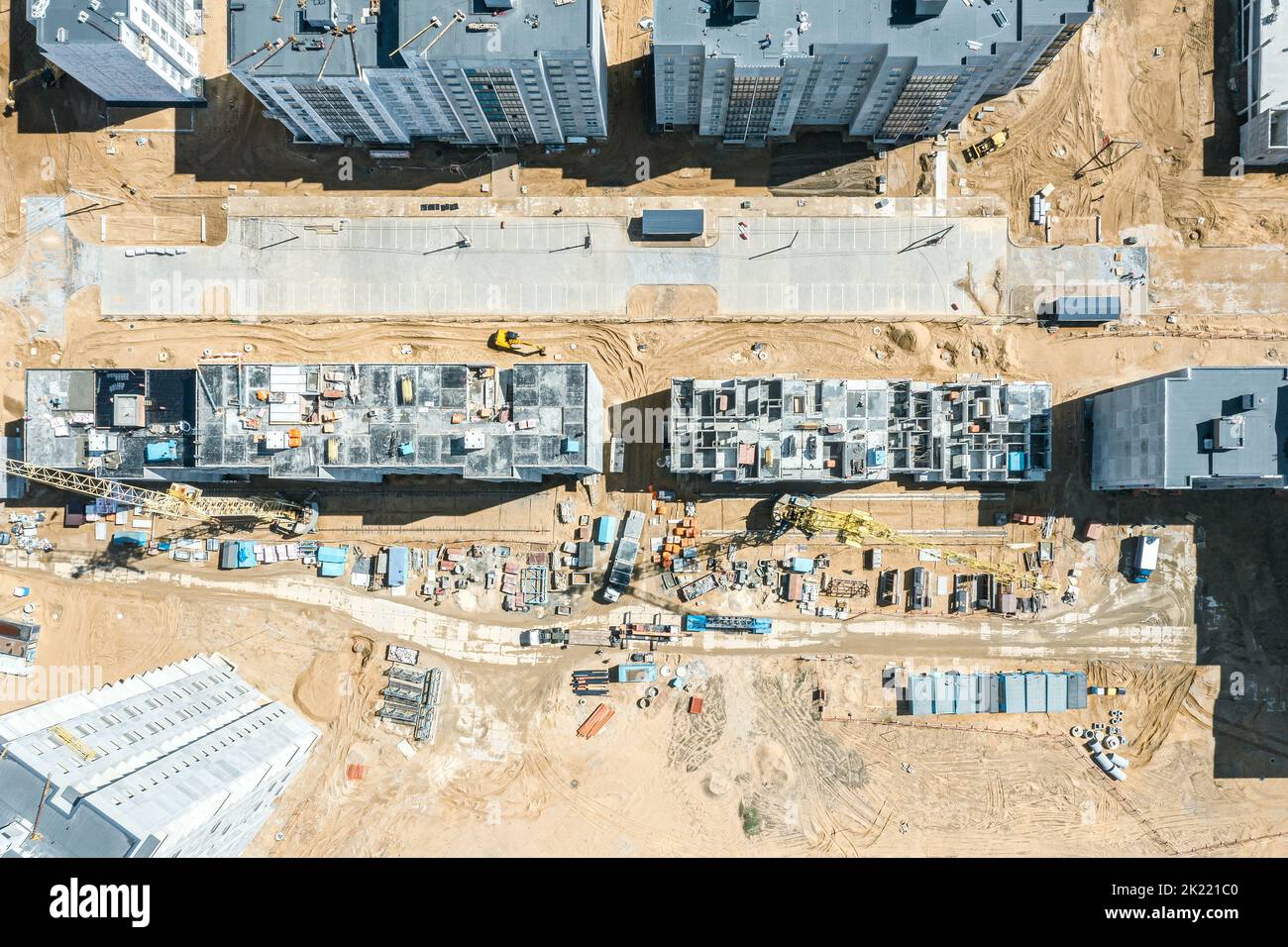 construction site with building cranes, other equipment and construction materials. aerial top view. Stock Photo
