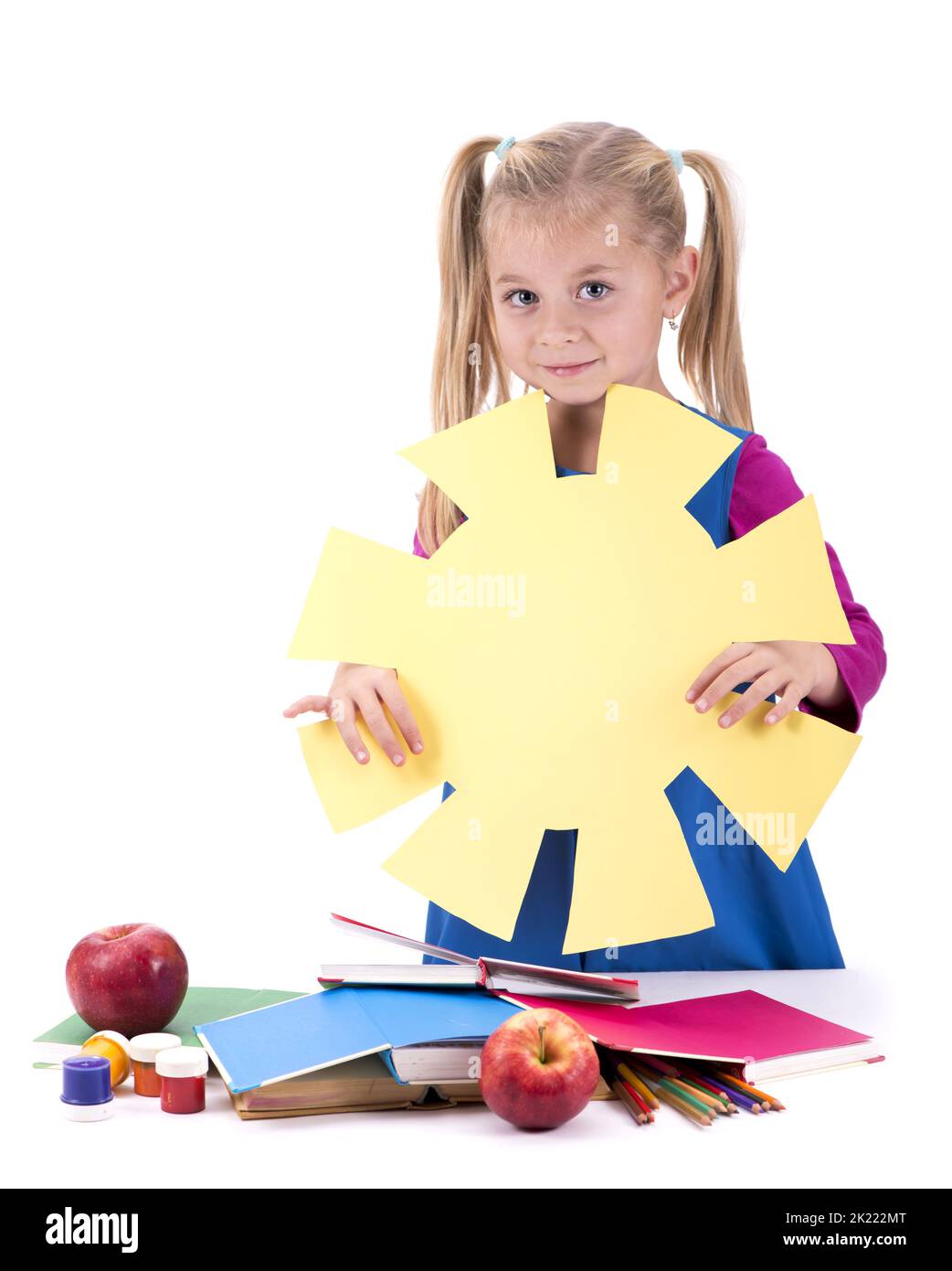 Creativity concept. hild and creativity. girl cuts the sun out of colored paper. isolated on white Stock Photo
