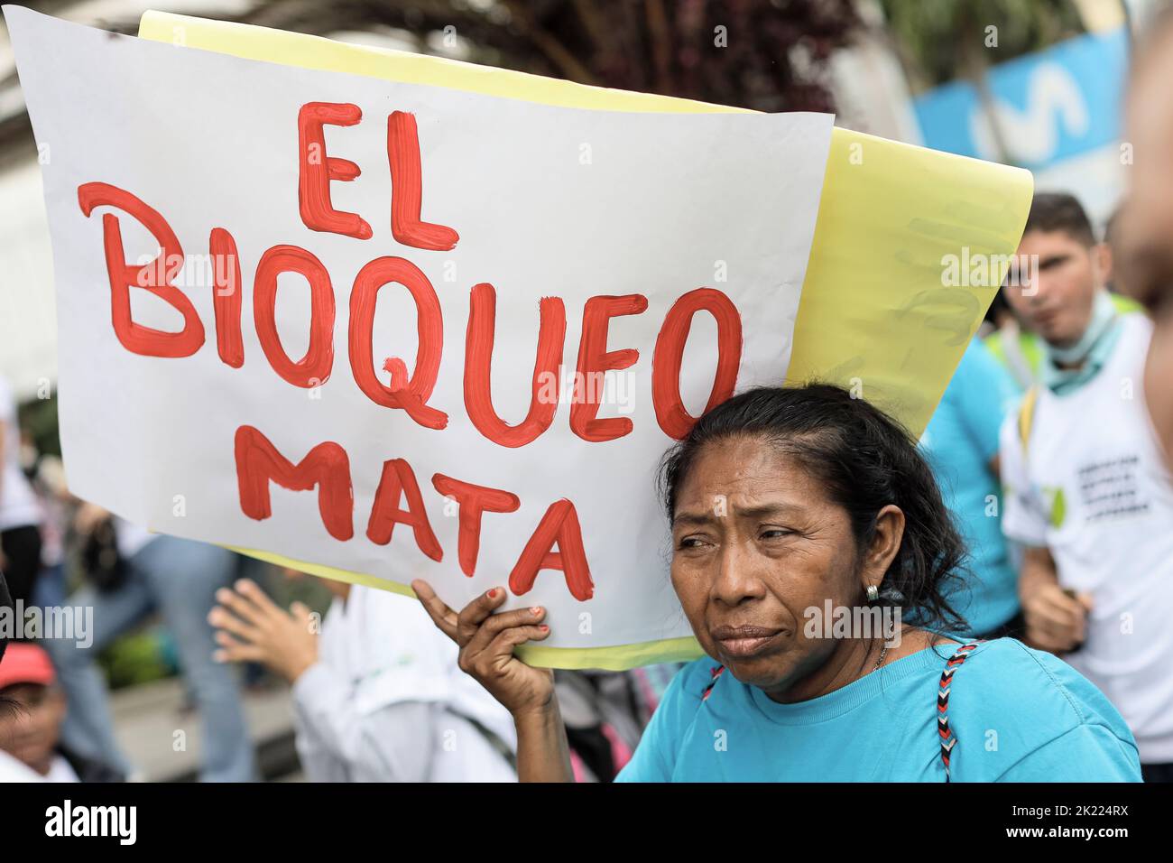 Caracas, Venezuela. 21st Sep, 2022. A woman holds a sign reading in Spanish 'El Bloqueo Mata' (The Blockade Kills) during a demonstration against economic sanctions called by peasant movements in front of the UN Mission in Caracas, Venezuela. Credit: Jesus Vargas/dpa/Alamy Live News Stock Photo