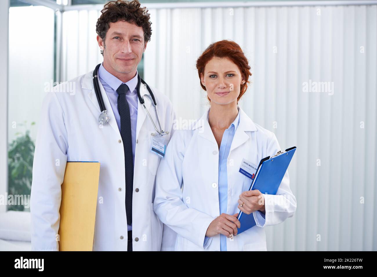 A trustworthy team. two doctors looking happily at the camera. Stock Photo