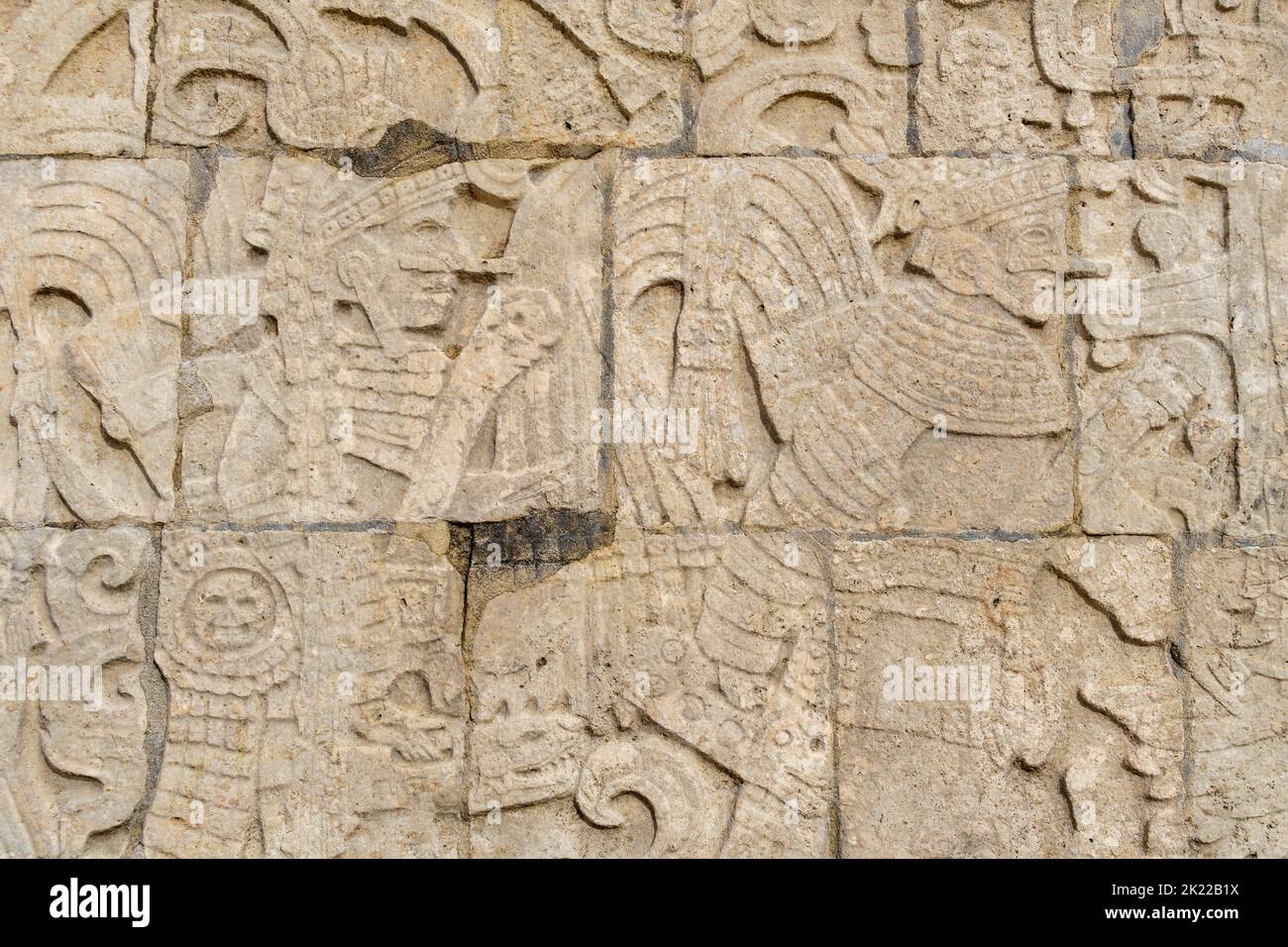 Stone carvings along the walls of the Main Ball Court in Chichen Itza