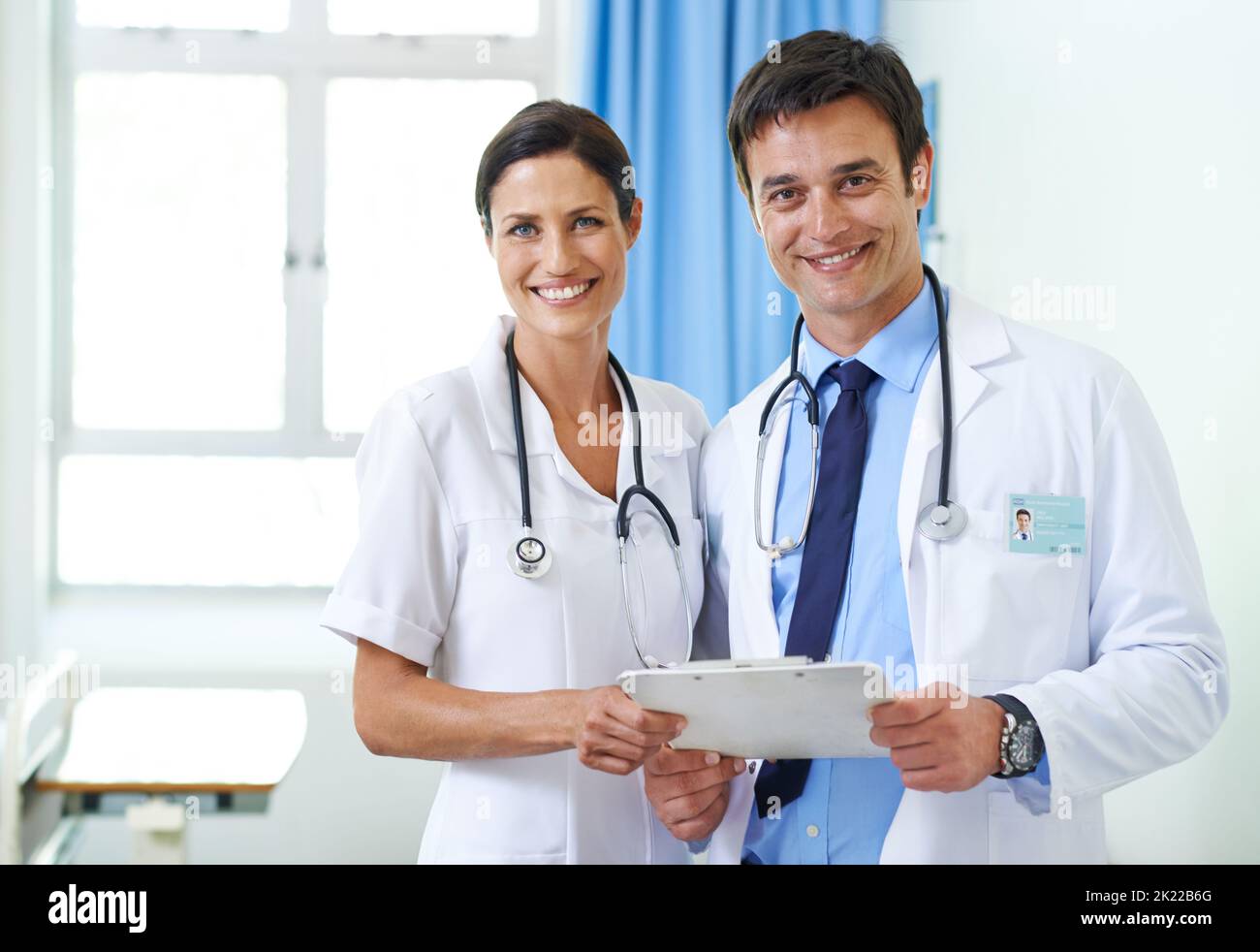 Theyre on top of this case. Portrait of a smiling medical team checking ...