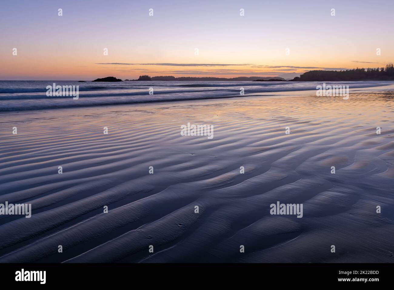 Sand ripples at sunset on Chesterman beach with long exposure, Tofino, Vancouver Island, British Columbia, Canada. Stock Photo